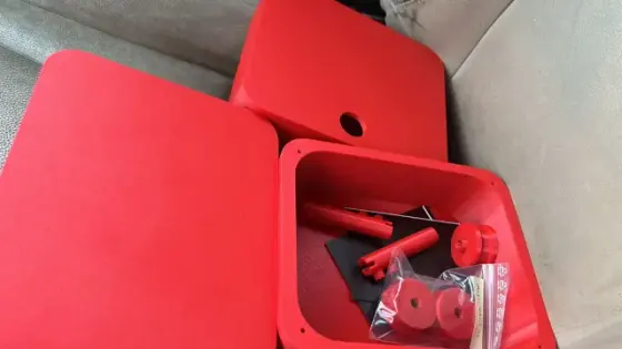Red 3D-printed enclosure and mechanical prototype parts